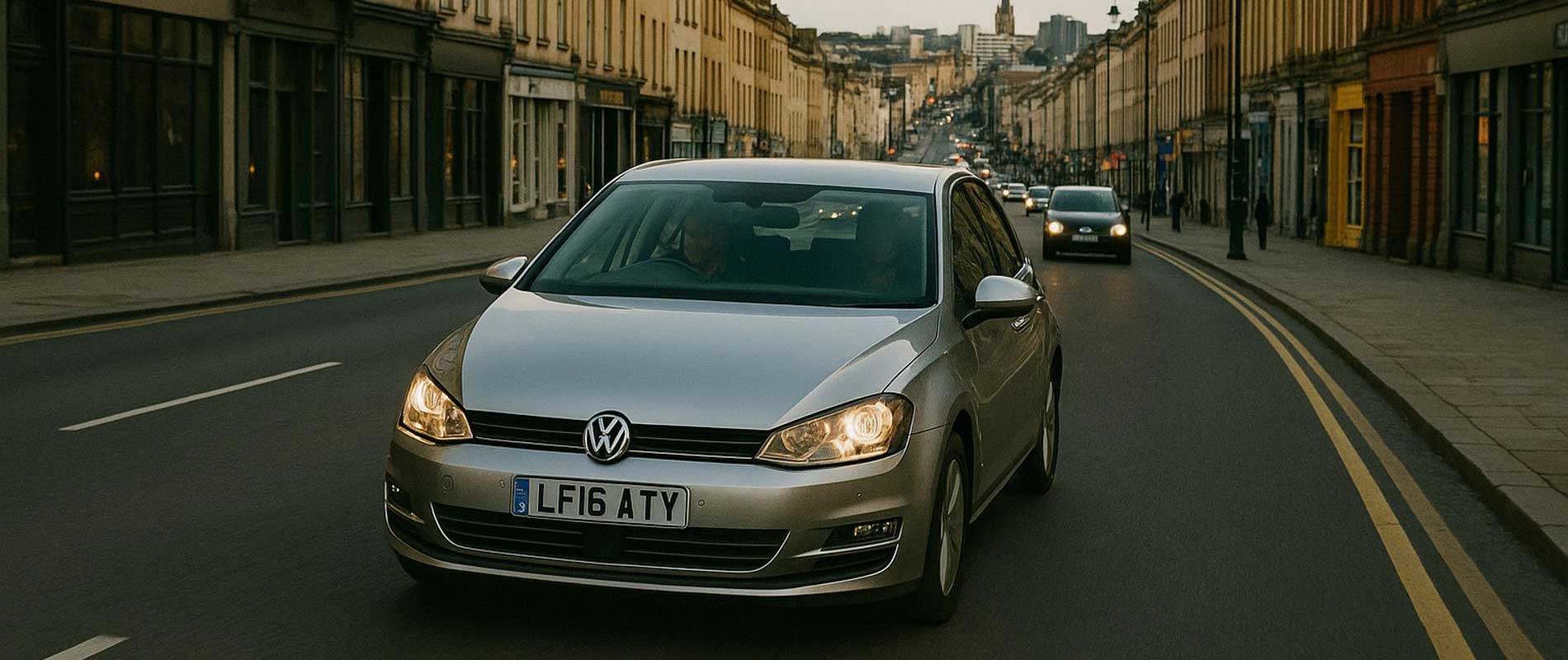 A car waiting at a pedestrian crossing in bristol